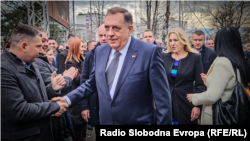 The president of Bosnian entity Republic of Srpska, Milod Dodik, greets supporters after his verdict at a cour in Banja Luka on February 26.