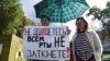 A woman holds a placard reading "You can't shut up everyone!" as journalists and supporters take part in a protest against Russia's "foreign agent" law in Moscow in September.