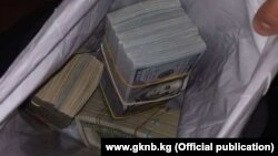 Тинтүү учурунда табылган акча. 