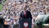 Polish President Karol Nawrocki speaks at a military parade in Warsaw on August 15.