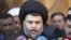 Iraqi Shi'ite cleric Muqtada al-Sadr speaks to the media during a visit to the Our Lady of Salvation Church in Baghdad on January 4.