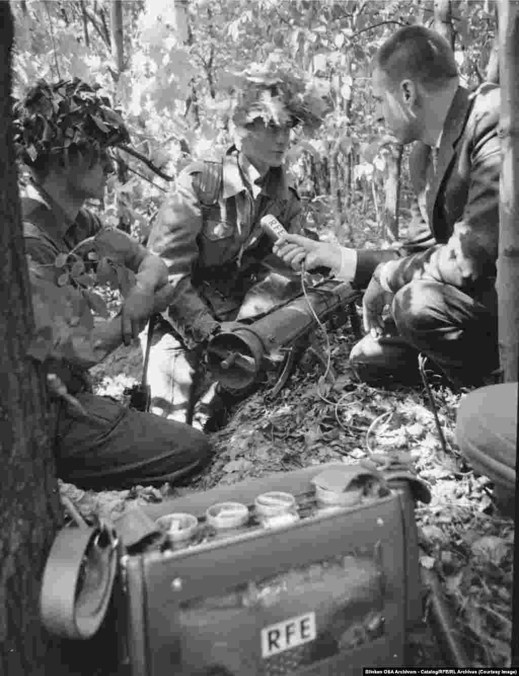 Radio Free Europe's Berlin correspondent Tom Bodin talks with a US soldier during a joint Anglo-American training exercise in West Berlin's Grunewald forest in 1964.Radio was seen as an ideal medium for reaching populations living under repressive regimes, in part because it left no incriminating trace. Listeners could tune into a broadcast then simply twist the dial to another frequency.