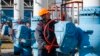 UKRAINE -- FILES -- A worker turns a tap at the gas-compressor station in Mryn village, about 130 km of Kiev, Ukraine, 15 October 2015.