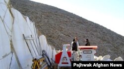 Laborers work at a marble stone factory in western Afghanistan.