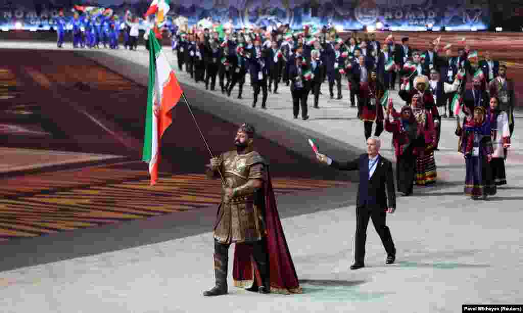 The Iranian team parades through the stadium during the opening of the games.The World Nomad Games were envisioned as a way for countries to showcase nomadic culture and traditional sports.