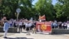 Protesters gather near the parliament building demanding Orhan Inan be found on June 3.