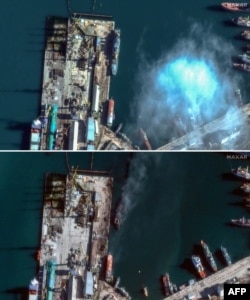 This combination of satellite images released on December 27 by Maxar Technologies and taken in the Russian-controlled eastern Crimean port of Feodosia on December 5 (top) and on December 26 (below), shows the Novocherkassk landing ship before and after the Ukrainian strike.