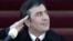A young Saakashvili salutes during his inauguration ceremony in 2004. Many held high hopes for his leadership. 
