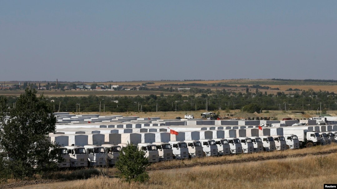 A Russian convoy of trucks carrying humanitarian aid for Ukraine waits at a camp near Kamensk-Shakhtinsky, in Russia's Rostov region.