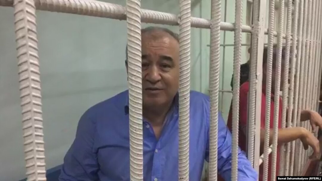 Omurbek Tekebaev in a cell during a court hearing