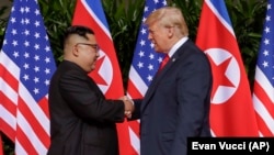 U.S. President Donald Trump (right) held an unprecedented first summit with North Korean leader Kim Jong Un in Singapore on June 12.