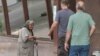 Armenia -- An elderly woman begs for money in Yerevan.