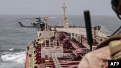 The US military enforces the blockade of Iranian ports on July 25 amid a pause in tit-for-tat strikes by the US and Iran in photo released by CENTCOM.
