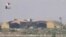 A still image, taken from a video broadcast on Syrian state television, shows a Syrian army airbase that was hit by a U.S. strike near the city of Homs, April 6, 2017. File photo