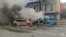 Russian firefighters extinguish fires in blazing cars following what local authorities say was a Ukrainian military strike on the city of Belgorod, in a photograph published on January 5.