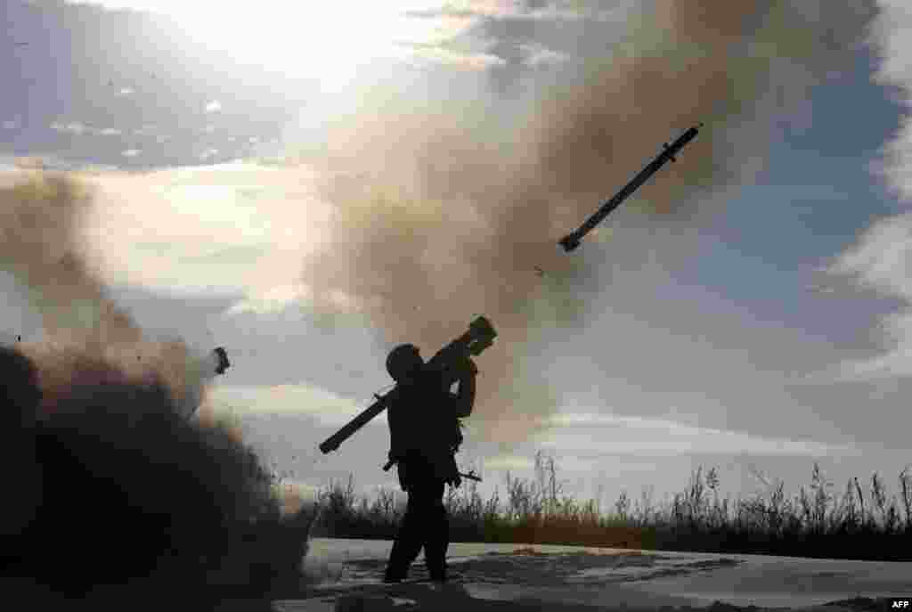 A Ukrainian soldier fires a missile with a portable air-defense system during exercices near the city of Shchastya, north of Luhansk, on December 1.