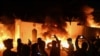 Demonstrators gather as flames start consuming Iran's consulate in the southern Iraqi city of Najaf on November 27. 