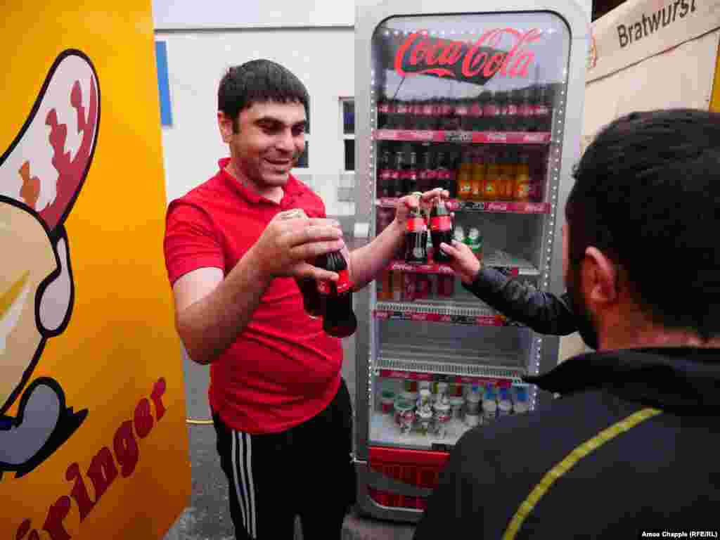 Makhitan Nahapetian, the owner of a local food stall, handed out free Cokes and other drinks to protesters.