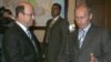Vladimir Putin (R) shakes hands with Russian politician Aleksandr Babakov (file photo)