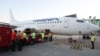 Armenia -- Workers at Zvartnots airport in Yerevan load relief supplies onto a plane bound for Lebanon, August 8, 2020.