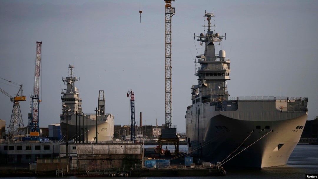 The Mistral-class helicopter carriers Sevastopol (right) and Vladivostok are seen at the STX Les Chantiers de l'Atlantique shipyard site in Saint-Nazaire, France, on May 21.