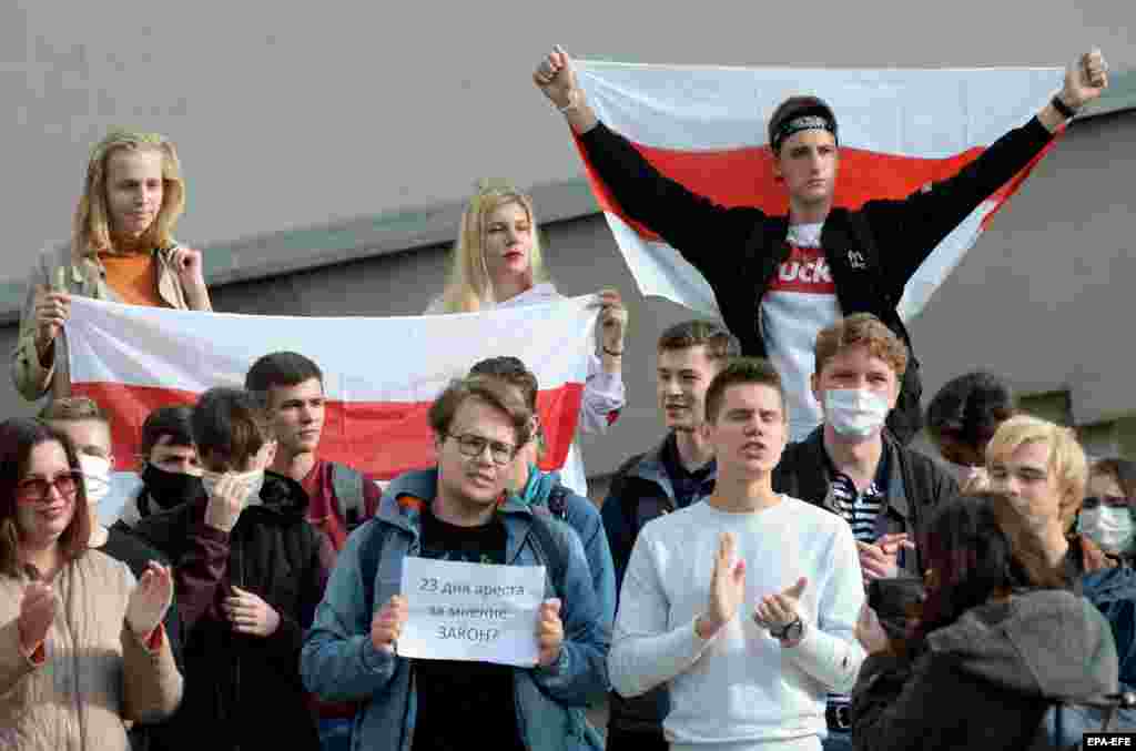 The sign says, &quot;23 days for an opinion. Law?&quot; The message is in reference to the detention of Dima Mazuro for his speech.