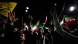 Iranian demonstrators chant slogans during an anti-Israeli gathering in front of the British Embassy in Tehran early on April 14.