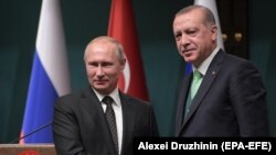 Russian President Vladimir Putin (left) shakes hands with Turkish President Recep Tayyip Erdogan following talks in Ankara in December.