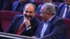 Armenia -- Prime Minister Nikol Pashinian (L) and Sasun Mikaelian attend a congress of the Yerkrapah Union in Yerevan, April 7, 2019.