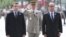 Current French President Francois Hollande (second-right) and President-elect Emmanuel Macron (left) take part in a ceremony to mark the end of World War II, in Paris on May 8. 