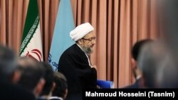 The former head of Iran's Judiciary (L) in the referral ceremony of his successor Ebrahim Raeisi, on March 11, 2019.