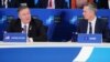 U.S. Secretary of State Mike Pompeo speaks as NATO Secretary-General Jens Stoltenberg listens during a NATO meeting in Washington on April 4. 