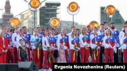 Athletes of the Russian Olympic Committee attend a welcoming ceremony after returning from the Tokyo 2020 Olympic Games on Red Square in Moscow in August 2021.