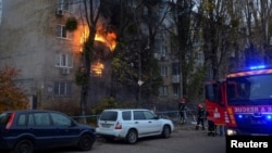 Russia launched a barrage of missile attacks against Ukraine on November 15 that hit residential buildings in Kyiv (pictured) and other sites across the country. Russian missiles also killed two people after hitting the Polish border village of Przewodow.