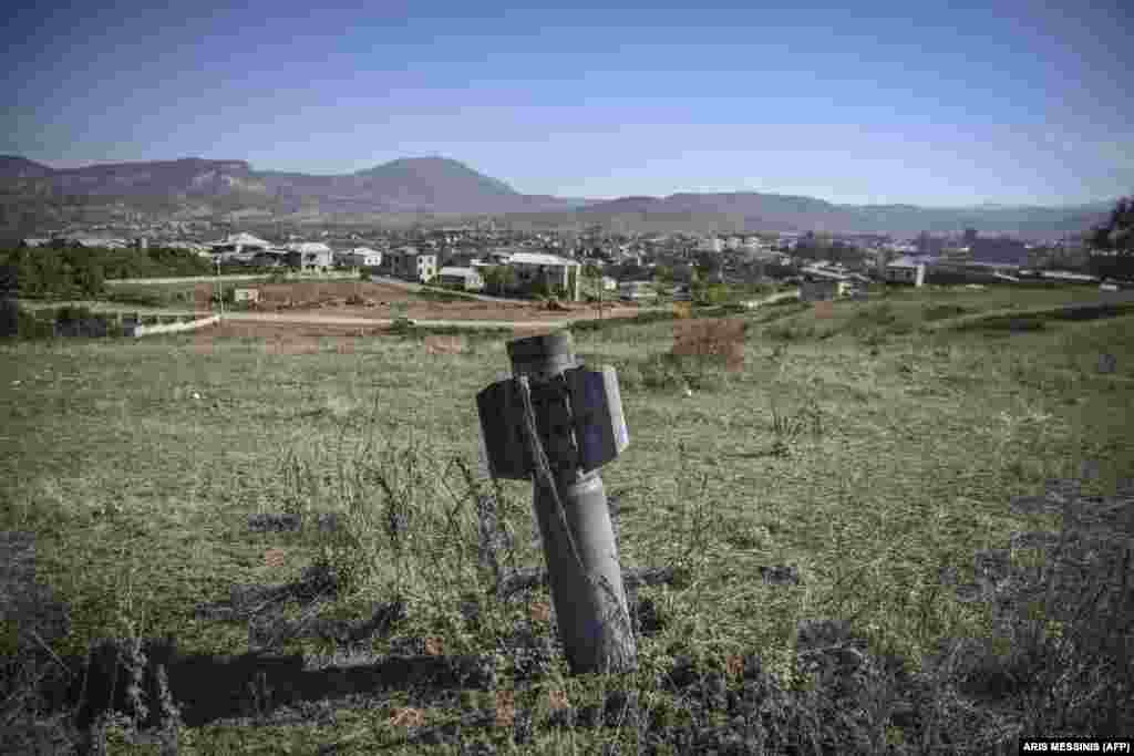 An unexploded BM-30 Smerch missile is seen on the outskirts of Stepanakert on October 12 during the ongoing military conflict between Armenia and Azerbaijan over the breakaway region of Nagorno-Karabakh. (AFP/Aris Messinis)
