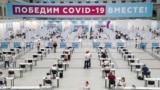 RUSSIA -- People wait to receive a shot of Russia's Sputnik V vaccine against COVID-19 disease at a vaccination center in Gostinny Dvor, a huge exhibition place in Moscow, Russia, 15 July 2021. 