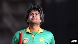 FILE: Ahmed Shehzad of Pakistan walks off after being dismissed during the second Twenty20 cricket match between New Zealand and Pakistan.