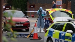 A member of the forensic team works at the scene after a man was arrested following a stabbing incident in the Golders Green area, which is home to a large Jewish population, in London on April 29.