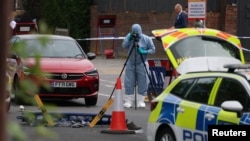 A member of the forensic team works at the scene after a man was arrested following a stabbing incident in the Golders Green area, which is home to a large Jewish population, in London on April 29.