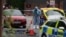 A member of the forensic team works at the scene after a man was arrested following a stabbing incident in the Golders Green area, which is home to a large Jewish population, in London on April 29.