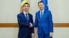 Siegfried Muresan, head of the EU Parliament delegation for relations with Chisinau (right), and Moldovan Foreign Minister Mihai Popsoi (file photo)