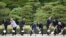 G7 leaders take part in a tree-planting ceremony on the grounds at Ise-Jingu Shrine in the city of Ise on May 26. (Left to right: Italian Prime Minister Matteo Renzi, German Chancellor Angela Merkel, U.S. President Barack Obama, Japanese Prime Minister Shinzo Abe, French President Francois Hollande, U.K. Prime Minister David Cameron, Canadian Prime Minister Justin Trudeau, and European Commission President Jean-Claude Juncker)
