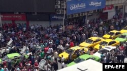 File photo Iranian protesters shout slogans as they gather at a street close to a bazaar in Tehran, Iran, 25 June 2018