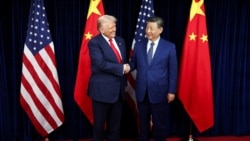 US President Donald Trump shakes hands with Chinese leader Xi Jinping as they hold a bilateral meeting in Busan, South Korea, on October 30, 2025.