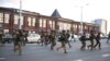 Vehicles with riot police officers during a protest against the results of the 2020 Belarusian presidential election. 