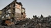 Rescuers work at the site of an apartment building hit by a Russian air strike in Zaporizhzhya on November 7.