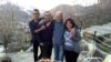 A photo provided by the family of the late Iranian-Canadian professor Kavous Seyed-Emami, shows him (2nd R), his wife, Maryam Mombeini (R) and their two sons at an unidentified place in Iran, undated