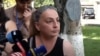 A woman who is looking for answers about the fate of her son who went missing during last year’s hostilities in Nagorno-Karabakh talks to media near the National Security Service building in Yerevan, Armenia, on August 19, 2021. 