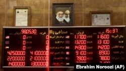 IRAN -- Various rates and prices for currencies and gold coins are displayed at an exchange bureau, in Tehran, August 21, 2019