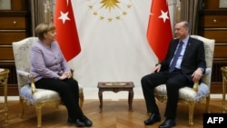 Turkish President Recep Tayyip Erdogan (right) meets with German Chancellor Angela Merkel in Ankara on February 2.